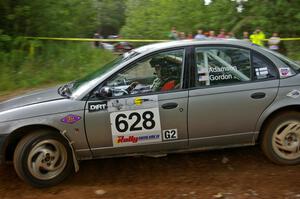 Dan Adamson / Chris Gordon take a hard left onto Potlatch Road on SS1 in their Saturn SL2.