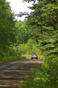 Mark Utecht / Rob Bohn at speed down a straight on SS2 in their Ford Mustang.