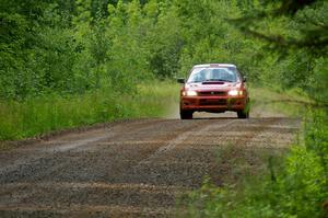 Dustin Kasten / Corina Soto at speed down a straight on SS2 in their Subaru Impreza.