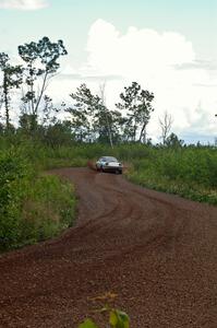 Doug Dill / Denny McGinn come through an S-curve in their Mazda RX-7 on SS3 as the rain increases.