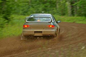 The Janusz Topor / Michal Kaminski Subaru Impreza drifts beautifully through a sweeper on SS4.