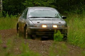 The Dan Adamson / Chris Gordon Saturn SL2 out of a left-sweeper at speed on SS4.