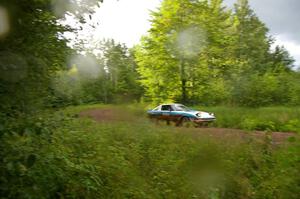 Doug Dill / Denny McGinn drift out of a sweeper on SS4 in their Mazda RX-7.