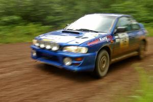 Kazimierz Pudelek / Michal Nawracaj at speed through a sweeper on SS4 in their Subaru Impreza.
