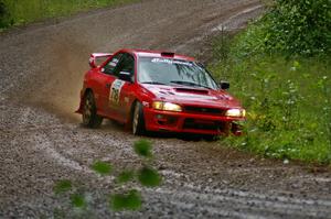 Dustin Kasten / Corina Soto do a little ditch-hooking on SS5 in their Subaru Impreza.