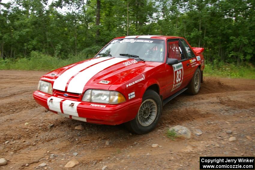 Mark Utecht / Rob Bohn make the hard left onto Potlatch Road on SS1 in their Ford Mustang.