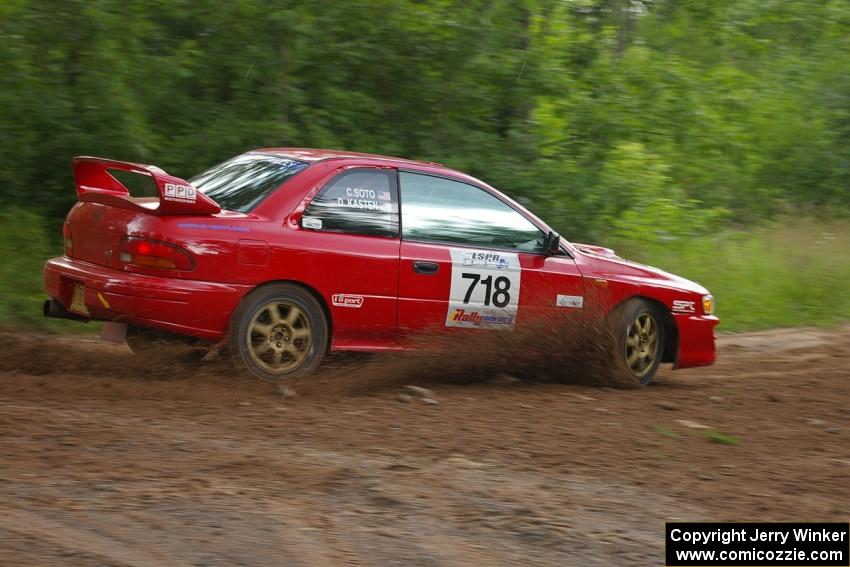 Dustin Kasten / Corina Soto make the hard left on SS1 onto Potlatch Road in their Subaru Impreza as the rain starts.