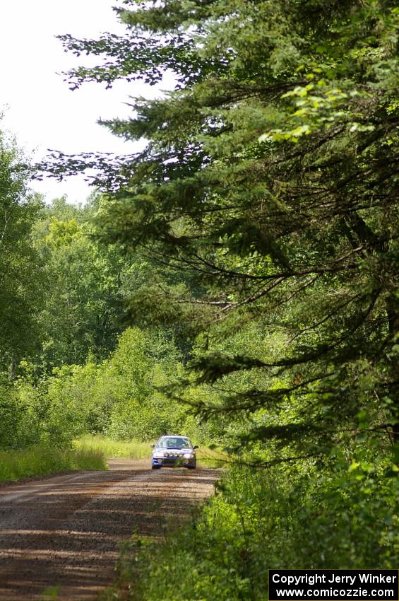 Kazimierz Pudelek / Michal Nawracaj blast their Subaru Impreza down a straight on SS2.