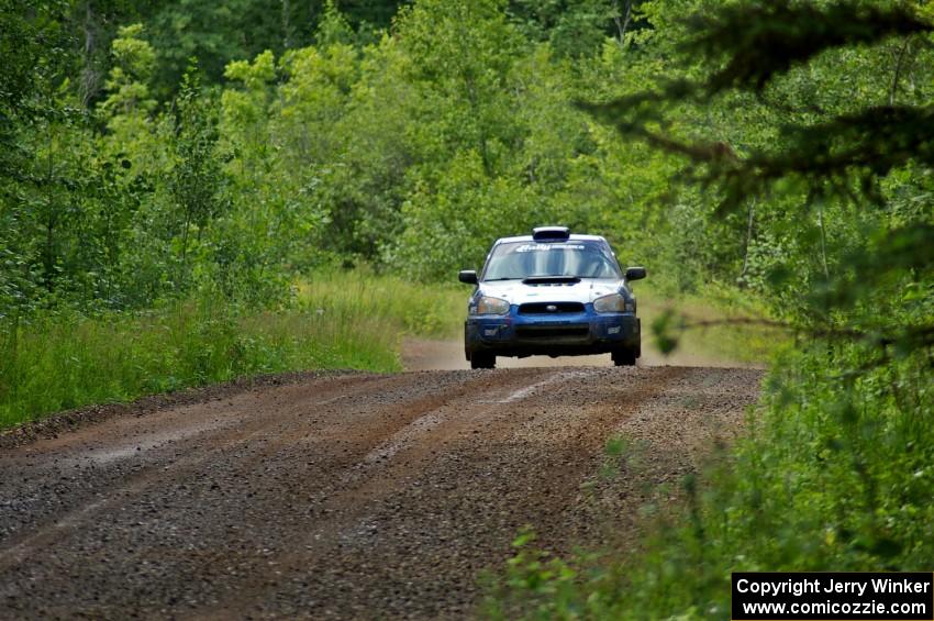 Slawomir Balda / Piotr Boczek at speed down a straight on SS2 in their Subaru WRX.