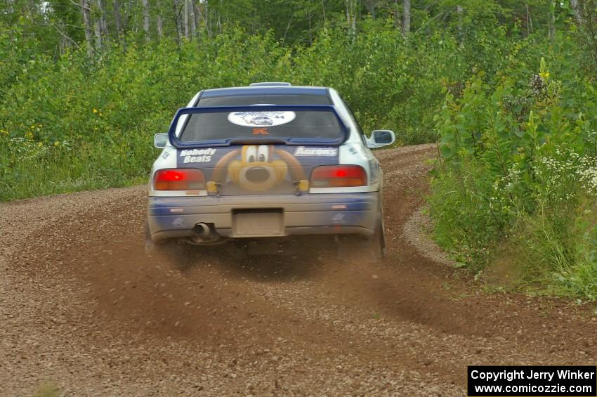 Mason Moyle / Scott Putnam drift their Subaru Impreza through a left-sweeper on SS3.