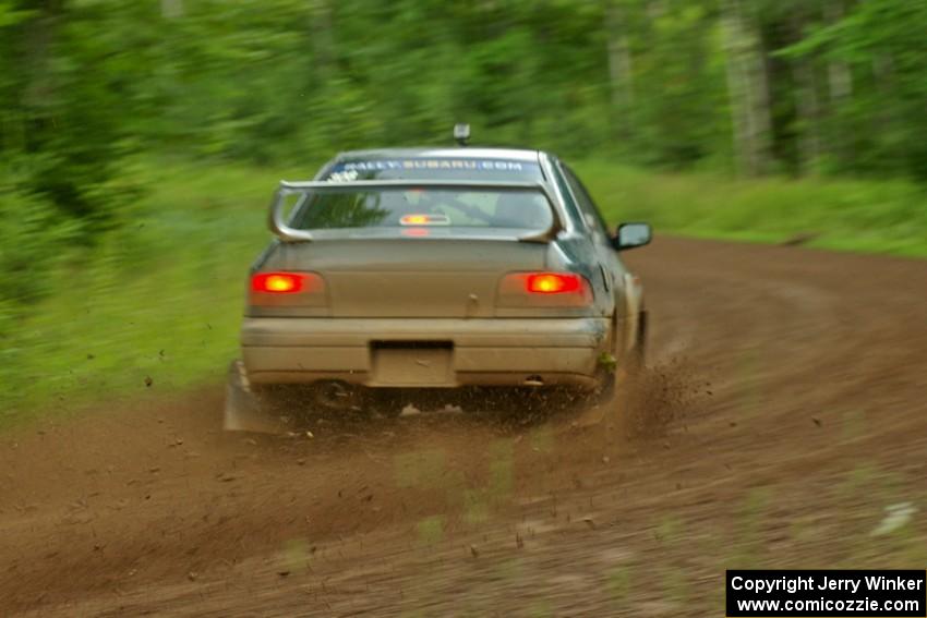 The Janusz Topor / Michal Kaminski Subaru Impreza drifts beautifully through a sweeper on SS4.