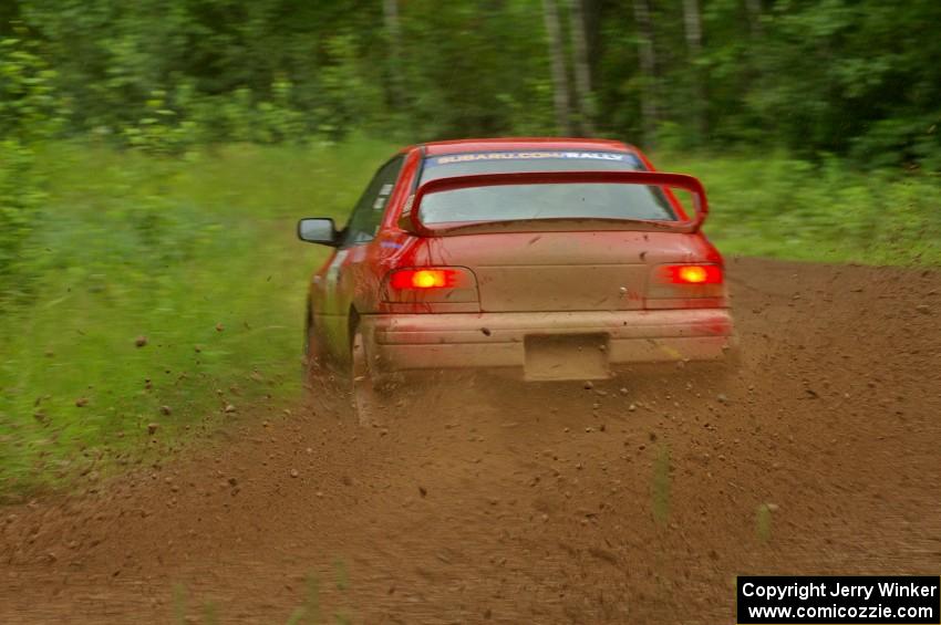 Dustin Kasten / Corina Soto drift beautifully through a sweeper on SS4 in their Subaru Impreza.