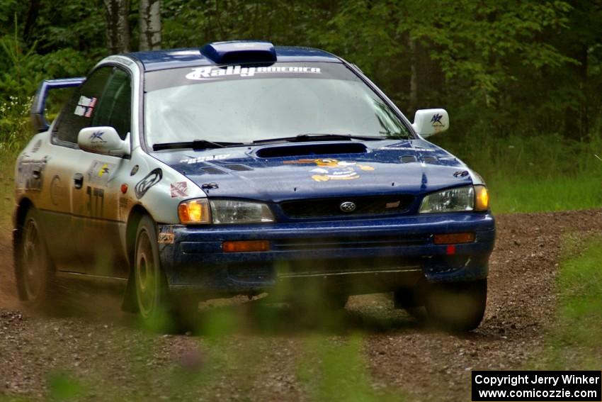Mason Moyle / Scott Putnam drift their Subaru Impreza out of a sweeper on SS4.