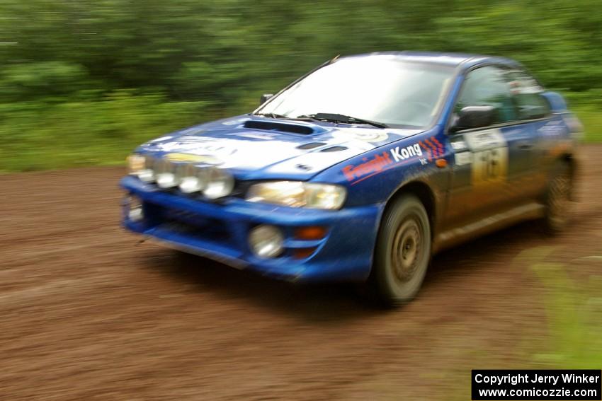 Kazimierz Pudelek / Michal Nawracaj at speed through a sweeper on SS4 in their Subaru Impreza.