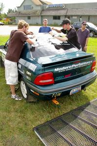 The Chris Greenhouse / Don DeRose Plymouth Neon gets more vinyl stickers added to the back window prior to the practice stage.