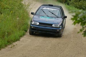 Paul Koll / Heath Nunnemacher take a fast right-hander on the practice stage in their VW Golf.