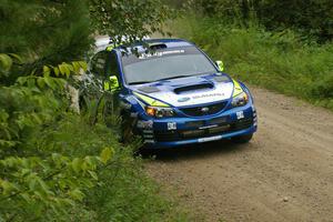 Travis Pastrana / Christian Edstrom set their Subaru WRX STi up for a left-hander on the practice stage.