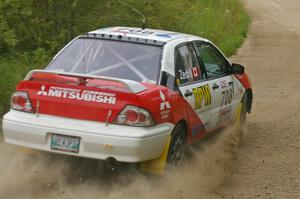 Jan Zedril / Jody Zedril take a fast left-hander on the practice stage in their Mitsubishi Lancer ES.