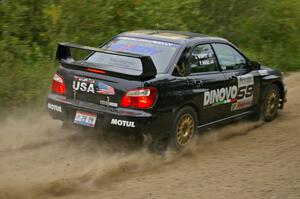 Pat Moro / Jeremy Wimpey slide through a fast left-hander in their Subaru WRX STi on the practice stage.