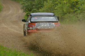 Piotr Wiktorczyk / Grzegorz Dorman slide their Subaru WRX STi through a corner on the practice stage.