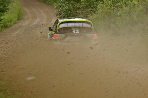 The Ken Block / Alex Gelsomino Subaru Impreza WRX STi exits a right-hander on the practice stage.