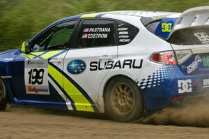 The Travis Pastrana / Christian Edstrom Subaru WRX STi powers out of a right-hander on the practice stage.