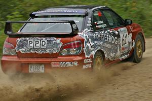 Piotr Wiktorczyk / Grzegorz Dorman sling gravel in their Subaru WRX STi on the practice stage.