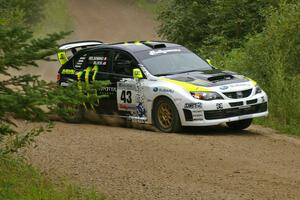 Ken Block / Alex Gelsomino set up for a left hander in their Subaru Impreza WRX STi on the practice stage.