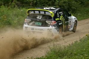 Ken Block / Alex Gelsomino rocket out a left hander in their Subaru Impreza WRX STi on the practice stage.