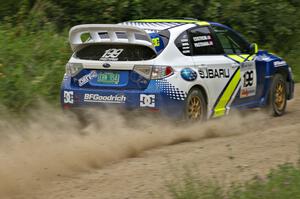 Travis Pastrana / Christian Edstrom set their Subaru WRX STi up for a left-hander on the practice stage.(2)