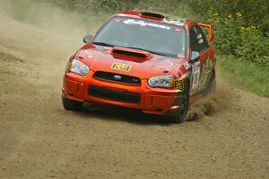 The Nate Conley / Adam Kneipp Subaru WRX STi at speed on the practice stage.