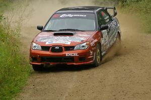 Piotr Wiktorczyk / Grzegorz Dorman Subaru WRX STi drifts through a right-hand corner on the practice stage.