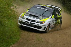 Ken Block / Alex Gelsomino clip the weeds on a practice run in their Subaru Impreza WRX STi.