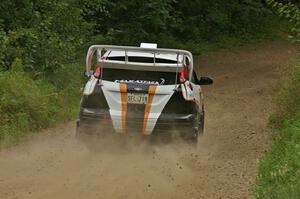 Dillon Van Way / Josh Knott blast their Ford Focus out of a left-hander on the practice stage.