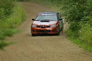 The Piotr Wiktorczyk / Grzegorz Dorman Subaru WRX STi sets up for a left-hand corner on the practice stage.