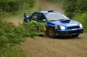 Janusz Topor / Michal Kaminski set up for a left-hander on the practice stage in their Subaru WRX STi.