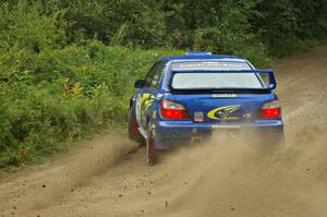 Janusz Topor / Michal Kaminski blast gravel on the practice stage in their Subaru WRX STi.