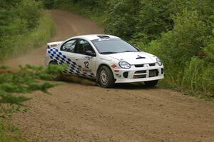 Zach Babcock / Jack Penley set their Dodge SRT-4 up for a left-hander on the practice stage.