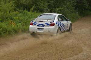 The Zach Babcock / Jack Penley Dodge SRT-4 blasts out of a left-hander on the practice stage.