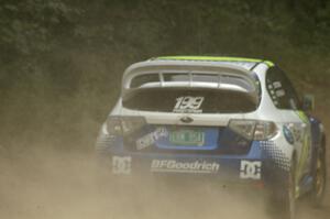 Travis Pastrana / Christian Edstrom power away out of a corner in their Subaru WRX STi on the practice stage.