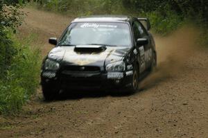 Pat Moro / Jeremy Wimpey drift their Subaru WRX STi out of a corner on the practice stage.