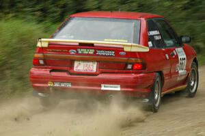 Paul Donlin / Elliot Sherwood slide their Ford Escort on the practice stage.