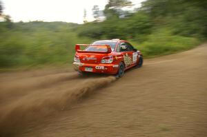 The Nate Conley / Adam Kneipp Subaru WRX STi kick up rooster-tails on the practice stage.