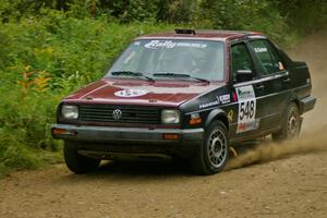 Matt Bushore / Kim DeMotte set their VW Jetta up for a fast right hander on the practice stage.