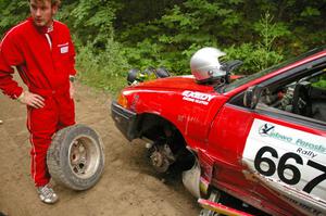 Note the hole punched by the tie rod into the wheel! Paul Donlin / Elliot Sherwood Ford Escort on the practice stage.