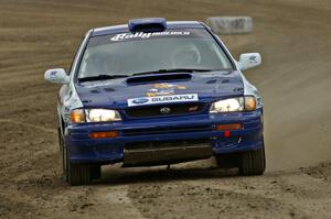 Mason Moyle / Scott Putnam prepare to exit the end of SS1 in their Subaru Impreza.