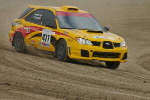 Don Conley / Chris Herlache drift on the high bank in their Subaru WRX Wagon on SS1.