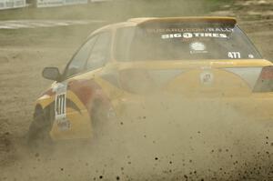 Don Conley / Chris Herlache throw a spray of gravel in their Subaru WRX Wagon on SS1.