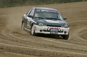 Chris Greenhouse / Don DeRose ride the middle of the bank on SS1 in their Plymouth Neon.