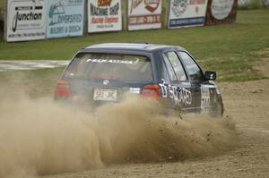 Paul Koll / Heath Nunnemacher come off the bank and set up for a hairpin on SS1 in their VW Golf.